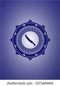 combat knife icon inside emblem with denim high quality background