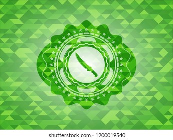 combat knife icon inside green emblem with mosaic ecological style background