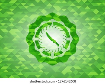 combat knife icon inside green emblem with mosaic ecological style background