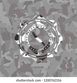 combat knife icon inside grey camouflage texture