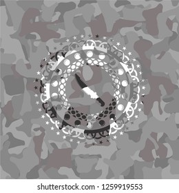 combat knife icon inside grey camo texture