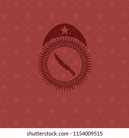combat knife icon inside realistic red emblem