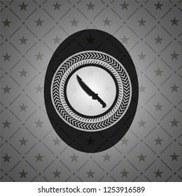 combat knife icon inside realistic dark emblem