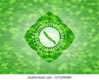 combat knife icon inside realistic green emblem. Mosaic background