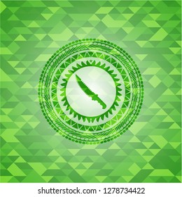combat knife icon inside realistic green mosaic emblem