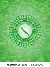 combat knife icon inside realistic green emblem. Mosaic background