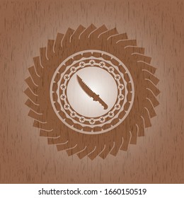 combat knife icon inside realistic wood emblem
