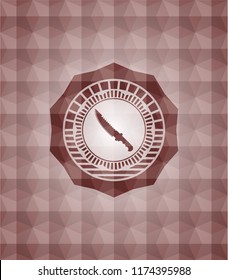 combat knife icon inside red seamless emblem with geometric pattern.
