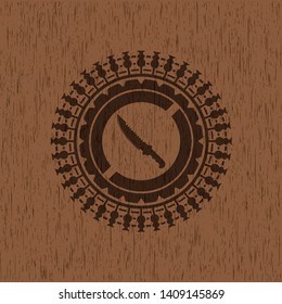 combat knife icon inside retro wood emblem