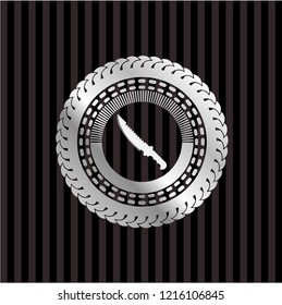 combat knife icon inside silvery emblem or badge