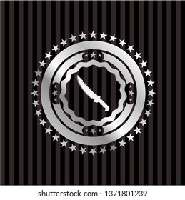combat knife icon inside silvery badge