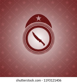 combat knife icon inside vintage red emblem