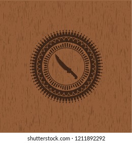 combat knife icon inside wooden emblem. Retro