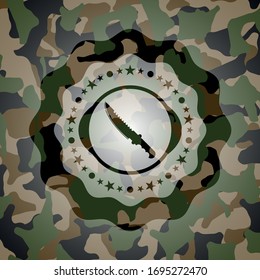 combat knife icon on camouflaged texture