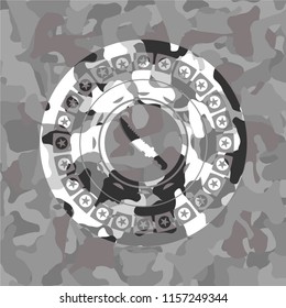combat knife icon on grey camouflaged texture