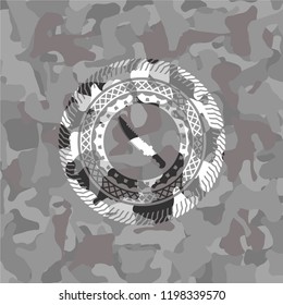 combat knife icon on grey camouflage pattern