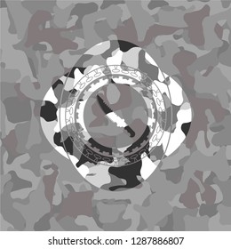 combat knife icon on grey camouflaged pattern