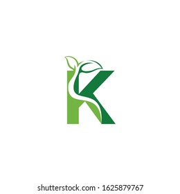 Combination of green leaf and initial letters K logo design vectors