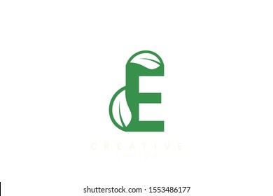 The combination of leaves and letters of the alphabet. Minimalist and simple design in green