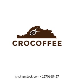 A combination of a lizard or crocodile with a bean for the coffee logo template icon
