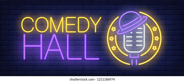 Comedy hall neon sign. Microphone with hat on brick background. Standup show, nightclub, performance. Night bright advertisement. Vector illustration for leisure, nightlife, entertainment