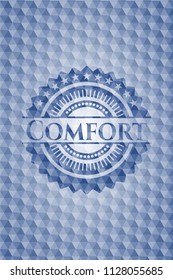 Comfort blue badge with geometric pattern background.