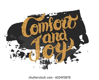 Comfort and Joy black and gold Christmas vector hand lettering. With palette knife ink splash