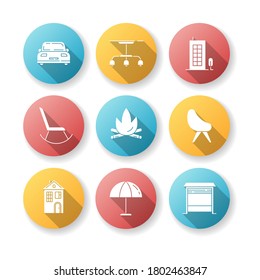 Comfort living flat design long shadow glyph icons set. Car in front side. Lamp hanging from ceiling. Tall building. Rocking chair. Comfortable armchair. Silhouette RGB color illustration