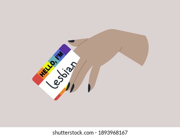Eine Hand, die einen Regenbogen-Namensschild mit dem Wort lesbian hält, LGBTQ Community