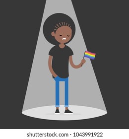 Coming out. Young upset homosexual character standing in a spotlight and holding an LGBTQ flag. Flat editable vector illustration, clip art