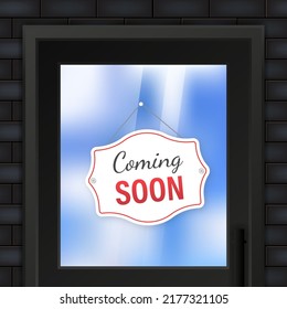 Coming soon hanging sign isolated on white wall.