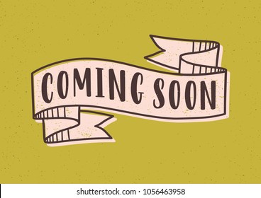 Coming Soon Lettering Or Inscription Written With Modern Font On Elegant Ribbon Or Tape Isolated On Yellow Background. Colored Vector Illustration For Video, Vlog, Advertising Or Teaser Campaign.