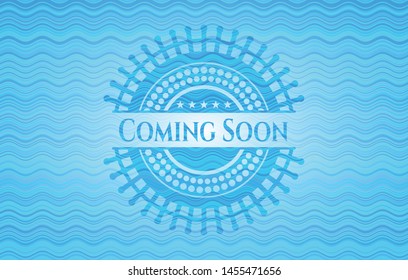 Coming Soon light blue water wave badge. Vector Illustration. Detailed.