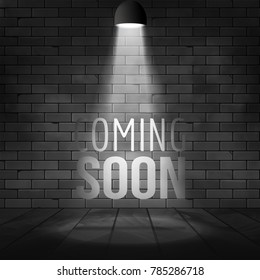 Coming soon message illuminated with light spotlight projector. Brick wall and stage realistic