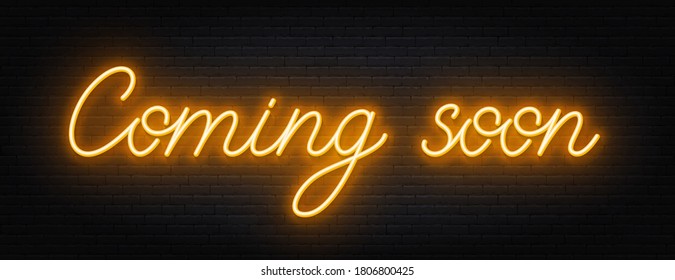 Coming soon neon script sign on brick wall background.