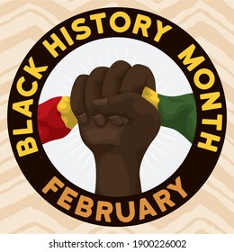 Commemorative round button with fist holding a tri-color flag, announcing Black History Month on February.