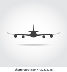 Commercial big plane from front, with long wings and four jet engenies.