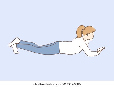 Communication, comfort, smart. Young smiling attractive girl using a smartphone writes or speaks at home after school.