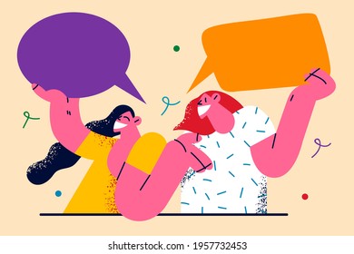 Communication, speech, chat concept. Two young smiling women friends cartoon characters standing holding blank speech bubbles isolated on light background vector illustration 