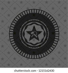 communism icon inside black emblem