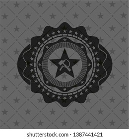 communism icon inside black emblem