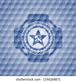 communism icon inside blue badge with geometric pattern background.