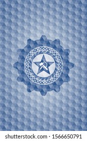 communism icon inside blue badge with geometric background.