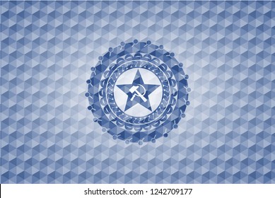 communism icon inside blue emblem with geometric pattern.