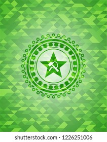 communism icon inside green emblem with mosaic background