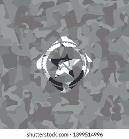communism icon inside grey camouflage emblem