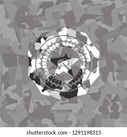 communism icon inside grey camouflaged emblem