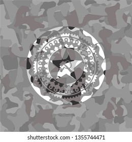 communism icon inside grey camouflaged emblem