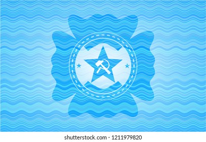 communism icon inside light blue water badge background.