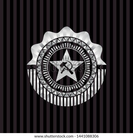 communism icon inside silver emblem or badge